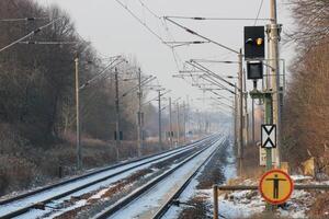 Snowy railtrack in Germany in winter on a winter day. photo