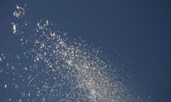 Water drops spraying from the fountain. photo