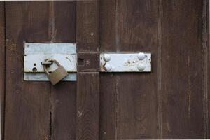Padlock hanging at a gate photo