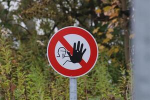 No trespassing sign in Germany with nature background. photo
