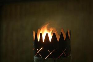Flame in a serrated goblet. photo