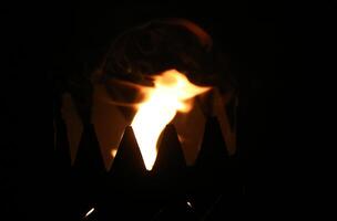 Flame in a serrated goblet photo