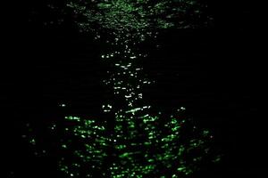 Gold light effect on water in hourglass shape. photo