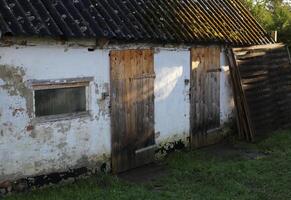 Part of an old shed in the sunlight. photo