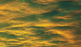 Impressive yellow and green cloudscape in the evening photo