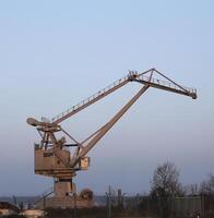 Gray crane in a harbor photo
