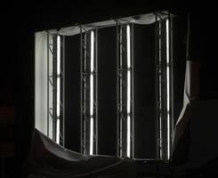 Illuminated panel ripped off showing the fluorescent tubes inside. photo