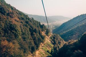 Landscape snowy mountains, tall mountain range in haze summer photo