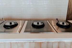 Buffet in hotel restaurant, various soups in pots, dinner in the dining room savory photo