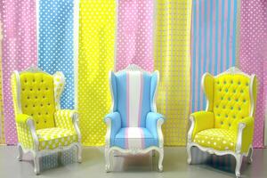 Colorful patterned chairs against a vibrant backdrop photo