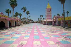 Pastel Pink and Blue Checkered Walkway at a Seaside Amusement Park photo