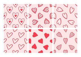 Collection of seamless patterns with red hearts on pink background vector
