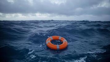 An orange life ring floats atop the tumultuous ocean waves, effectively highlighting its crucial and lifesaving role in various rescue operations that take place at sea during times of distress photo
