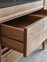 This closeup image of a wooden drawer highlights its intricate dovetail joints and warm tones, showcasing exceptional craftsmanship and attention to detail, blending tradition with modern design photo
