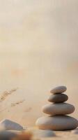 Stacked stones on sandy surface during calm sunset hours in nature photo