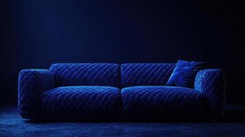 Cozy modern blue velvet couch set against a dark backdrop in a stylish interior photo