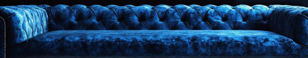 Elegant blue velvet sofa in a contemporary living space at night photo