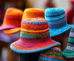 Colorful knitted hats displayed at a vibrant market showcase photo
