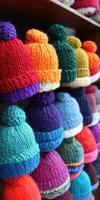 Colorful knitted hats displayed in a cozy shop for winter season photo