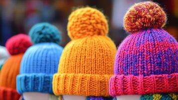 Colorful knitted hats displayed at a market stall during winter season photo