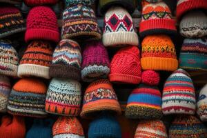Colorful handmade knit hats displayed at a market stall in winter photo