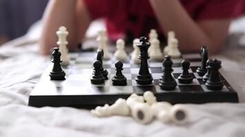 chess pieces on a chessboard. black pieces in the first row. chess close-up video