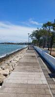 A Pathway blue sky with white clouds photo