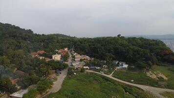 A view of a small town on a hillside photo