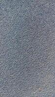 A close up of a black surface with a white spot photo