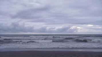 A view of the ocean and clouds from the beach photo