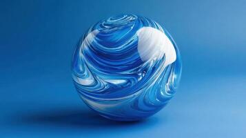 Blue swirling glass orb with white accents set against a solid blue background in a calm and artistic arrangement photo