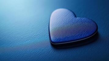 Heart shaped object on a blue background representing love and affection in a calm setting photo