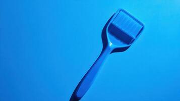 Blue rolling tool for beauty routine used on glowing surface in bright light setting photo