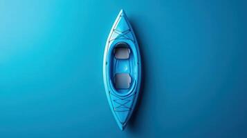 Bright blue kayak resting on calm turquoise water under clear sky in a serene outdoor setting photo