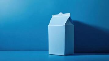 Simple blue milk carton against a solid blue background highlighting minimalist design and color contrast in contemporary art photo