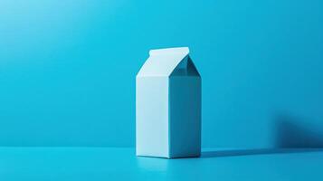 Milk carton sits on a solid turquoise background creating a vibrant and modern aesthetic while showcasing minimalist design elements photo