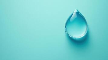 Water droplet resting on a light blue surface, reflecting soft light in a serene setting during the daytime photo