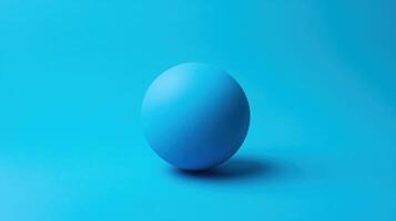 Bright blue sphere rests on vibrant blue background inviting creativity and calmness photo