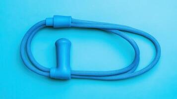 Fitness equipment for skipping rope training displayed on a vibrant blue background photo