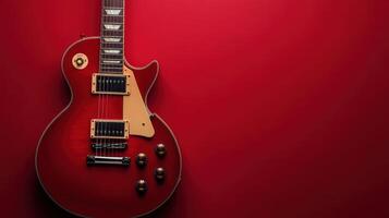 Classic electric guitar resting on vibrant red background during a music studio session photo