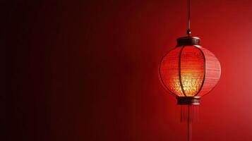 Bright red lantern hanging against a deep red background, capturing the essence of traditional celebrations in Asian culture photo