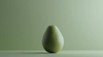 Fresh green avocado displayed on a light surface with a subtle background highlighting its texture and plumpness photo