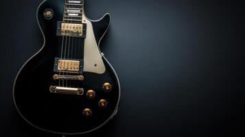 Black electric guitar resting on a dark surface with polished chrome hardware and elegant design photo