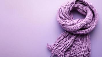 Soft lilac scarf neatly arranged on a pastel background creating a cozy and inviting atmosphere for winter fashion lovers photo