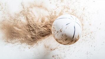Basketball bouncing off a sandy surface during a sports activity in an outdoor setting photo
