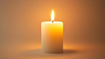 Soft glow of a single wax candle illuminating a calm space in warm hues ideal for relaxation and meditation photo