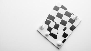 Creative black and white checkerboard art piece displayed on a minimalistic surface photo