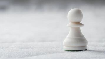 White chess pawn positioned on a white surface, emphasizing minimalism and strategy in a quiet setting photo