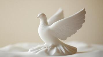 Elegant white dove sculpture on a soft surface highlighting delicate craftsmanship and serene design elements in bright lighting photo