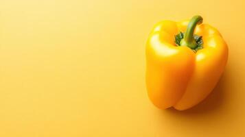 Yellow bell pepper on a bright yellow background presents vibrant colors and fresh produce for culinary use or decoration photo